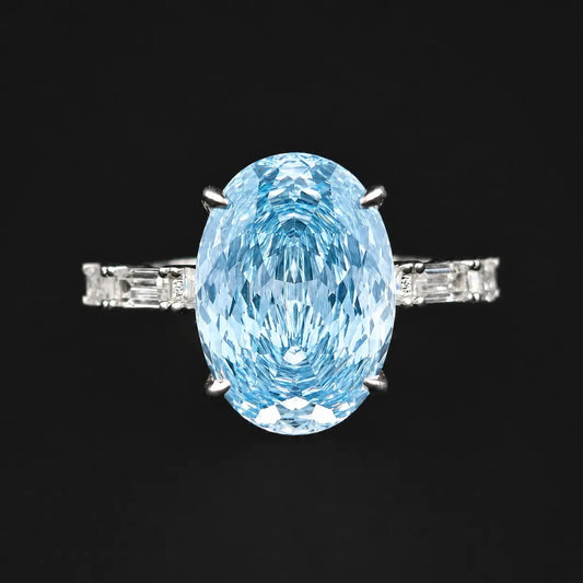 Top view of blue oval Rose cut solitaire ring with baguette accent band in 925 sterling silver