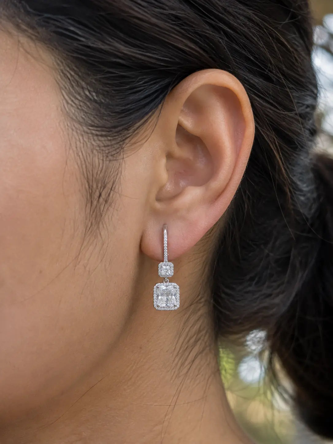 live view picture of silver double radiant halo drop earrings.