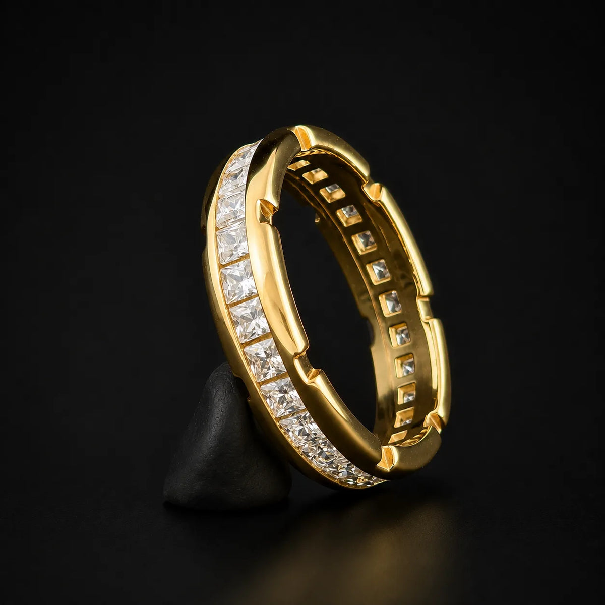 Side perspective of 925 silver, notched rim eternity band with princess cut stones